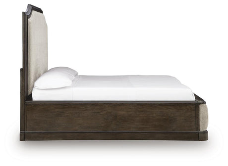 Wickenger Dark Brown King Upholstered Panel Bed from Ashley - Luna Furniture