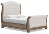 Ardenfield Light Brown Queen Upholstered Sleigh Bed from Ashley Furniture - Luna Furniture