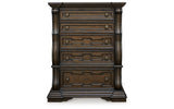 Maylee Dark Brown California King Upholstered Bed with Mirrored Dresser and Chest from Ashley - Luna Furniture