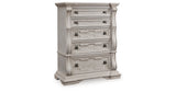 Bruchandi King Upholstered Panel Bed with Dresser and Chest in Antique White from Ashley Furniture - Luna Furniture