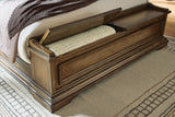 Frantanna Brown Queen Panel Storage Bed from Ashley - Luna Furniture