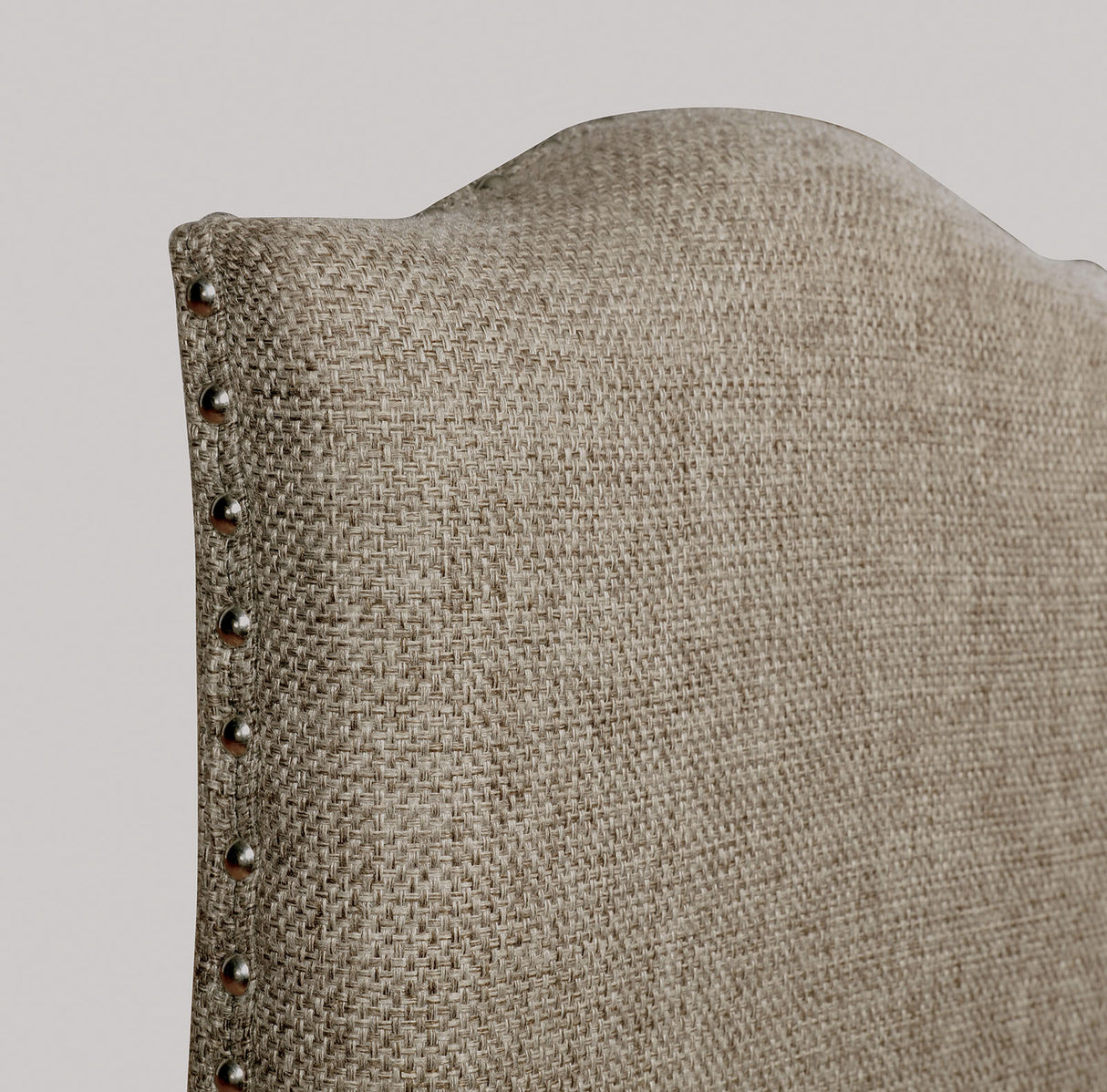 Faulk Espresso/Warm Gray chair back, upholstered tall back with nailhead trim, close-up detail