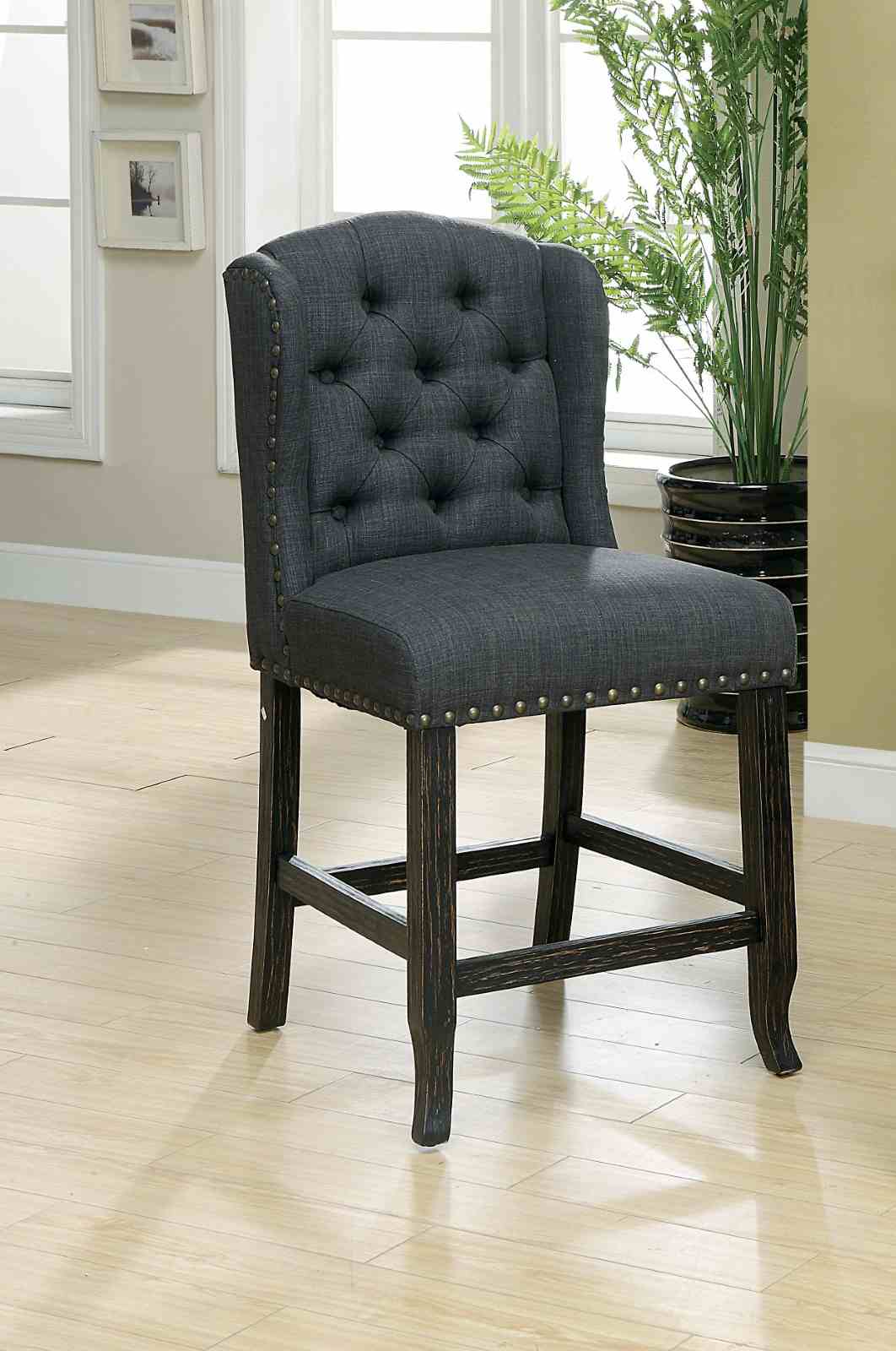 Sania Antique counter height chair, gray tufted upholstery and antique black finish, three-quarter view