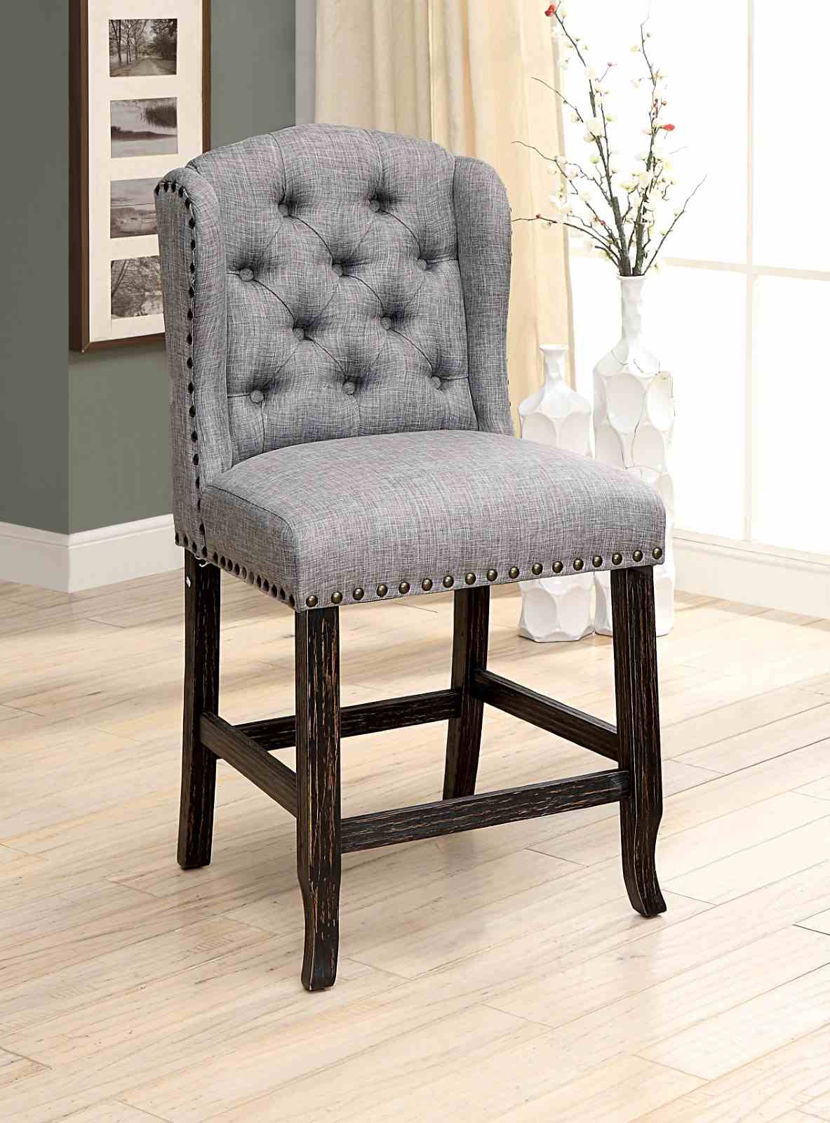 Sania Antique counter height chair, light gray tufted upholstery and antique black frame, three-quarter view