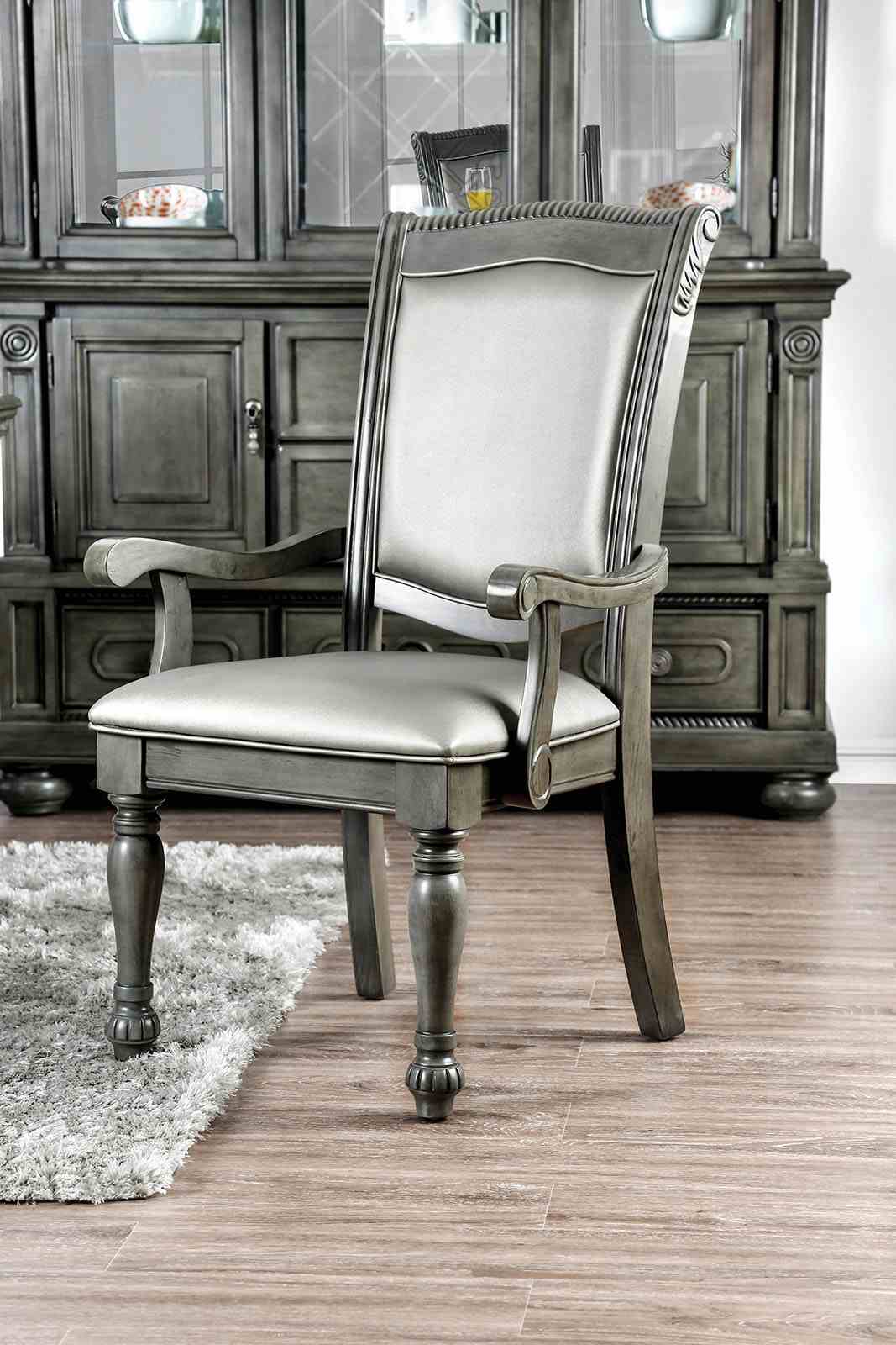Alpena Gray upholstered dining chair, carved arms and light gray seat, front view