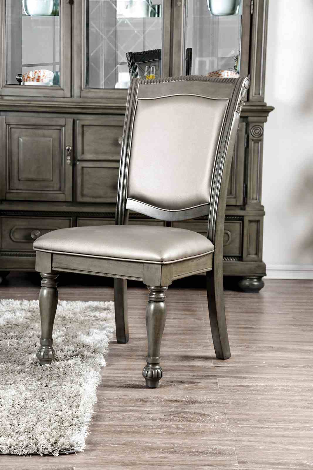 Alpena Gray upholstered dining chair, side chair profile with carved legs and light gray seat
