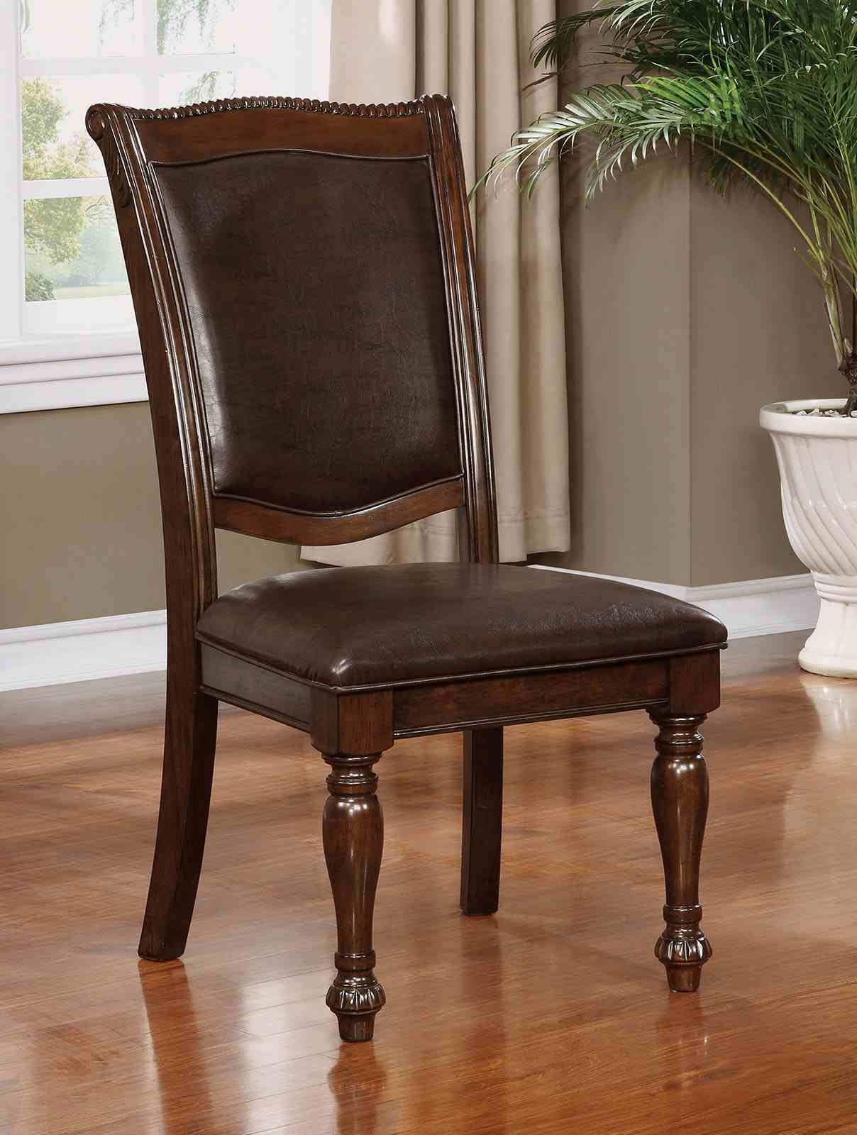 Alpena Brown dining chair, upholstered back and seat, carved wood legs, front view