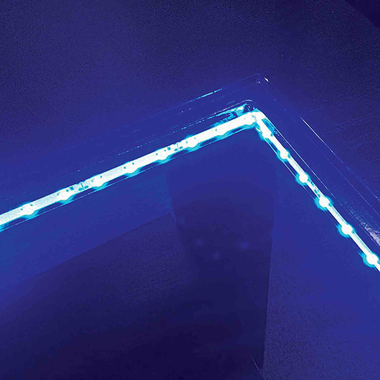 Luminar Black dining table LED inset, blue under-glow lighting detail