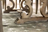 Patience Rustic dining table base, carved trestle support, close-up detail