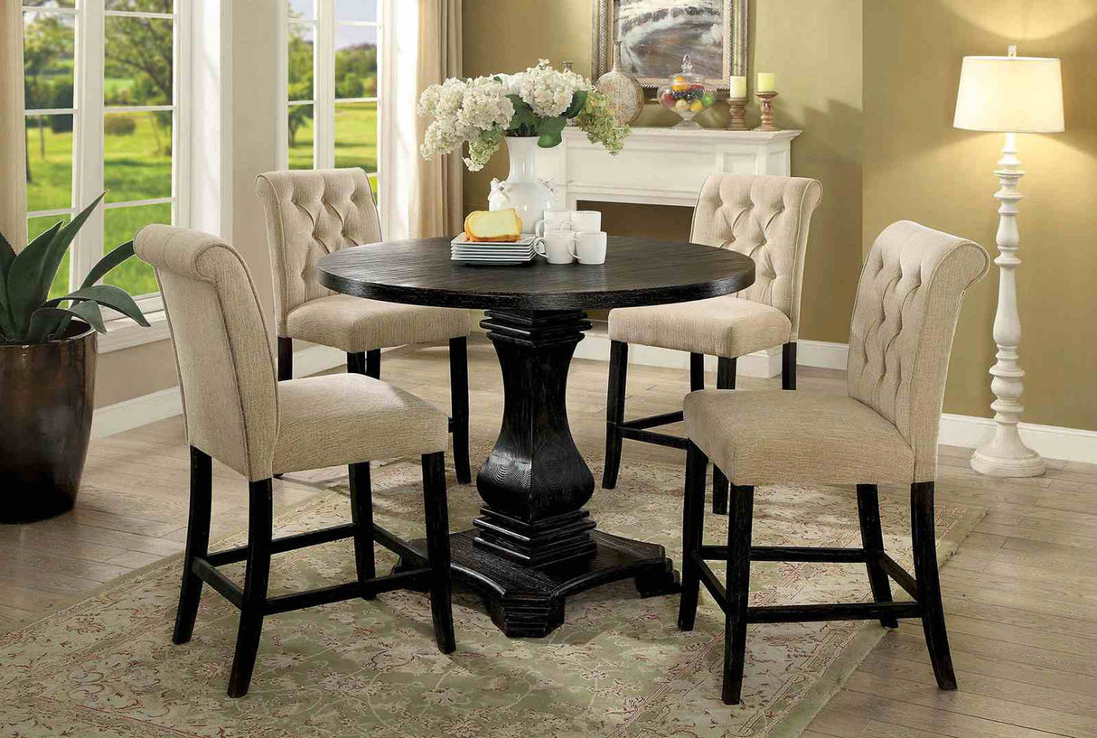 Izzy counter height dining set with round pedestal table, beige tufted chairs, lifestyle view