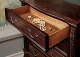 Flandreau Brown dresser drawer, felt-lined interior and ornate pull hardware, angled close-up