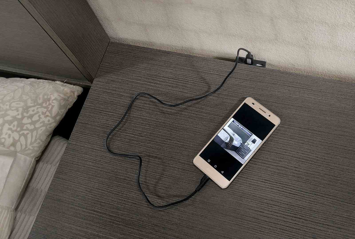 Camryn Warm nightstand, three drawers with chrome pulls and USB charger, bedside close-up