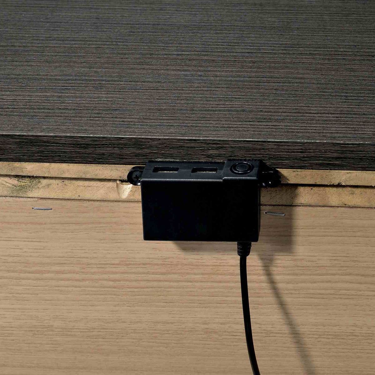 Camryn Warm nightstand power hub, USB charger detail under the tabletop, close-up