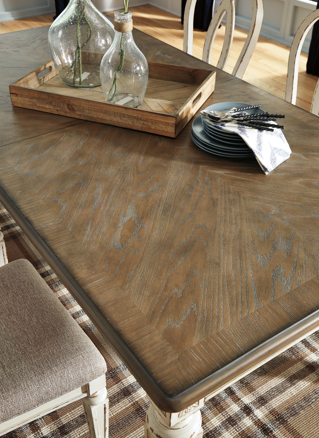 Realyn Chipped White Rectangular Dining Extension Table from Ashley - Luna Furniture