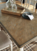 Realyn Chipped White Rectangular Dining Extension Table from Ashley - Luna Furniture