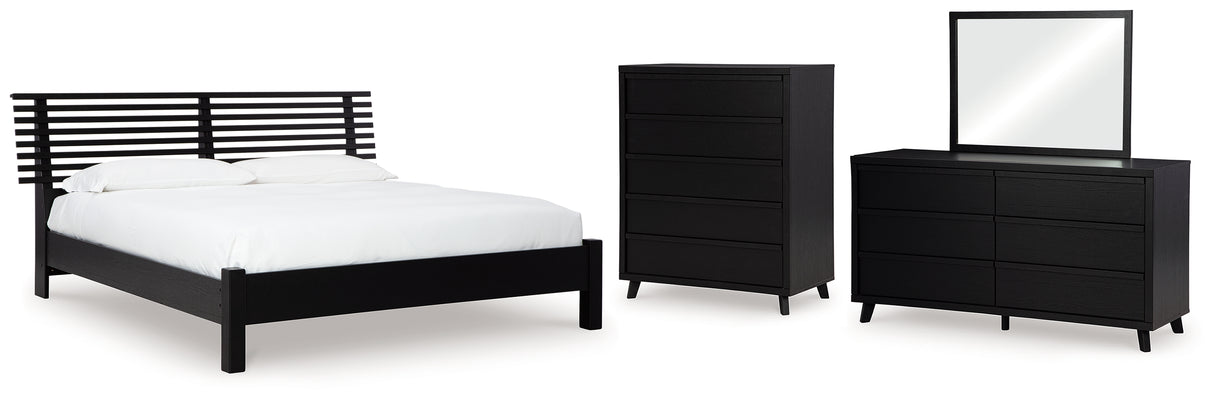 Danziar Queen Panel Bed with Mirrored Dresser and Chest in Black from Ashley - Luna Furniture