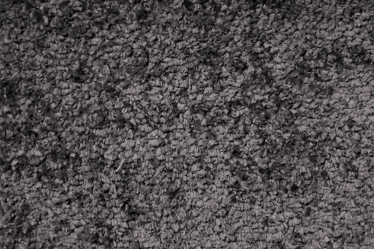 Hieronymus Dark Gray reclining sofa upholstery close-up, plush nubby fabric texture