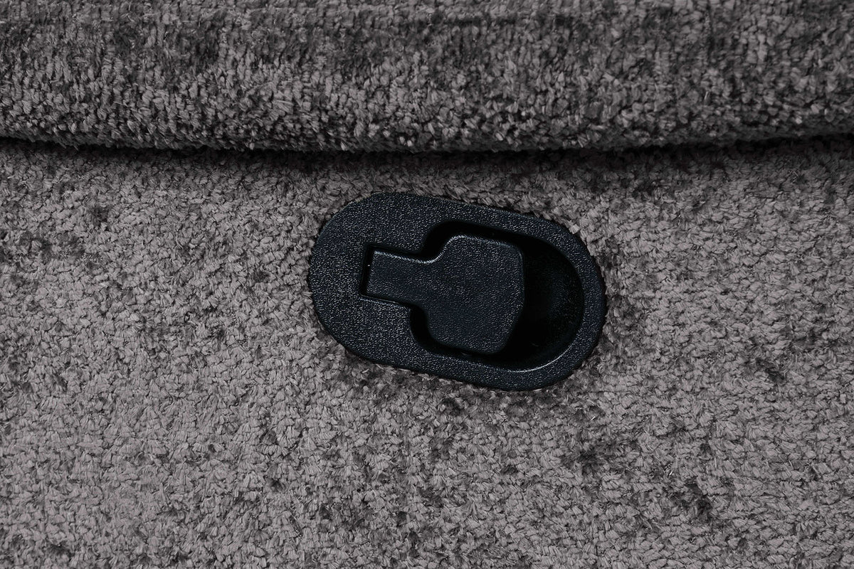 Hieronymus dark gray loveseat side detail, reclining release lever in textured upholstery