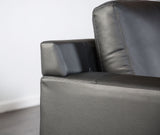 Stordal Black Sectional, track arm and cushion detail, black leather match, close-up