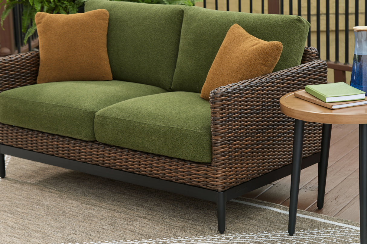 Horizon Hall Brown/Green Outdoor Loveseat with Cushion from Ashley Furniture - Luna Furniture