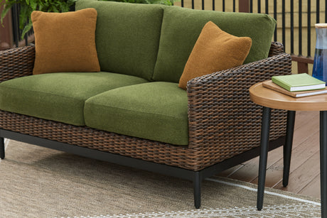 Horizon Hall Brown/Green Outdoor Loveseat with Cushion from Ashley - Luna Furniture