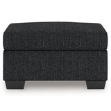 Jasmine Peaks Coal Ottoman from Ashley Furniture - Luna Furniture