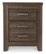 Juararo California King Panel Bed with Mirrored Dresser, Chest and Nightstand in Dark Brown from Ashley Furniture - Luna Furniture
