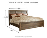 Juararo California King Panel Bed with Mirrored Dresser and Chest in Dark Brown from Ashley Furniture - Luna Furniture