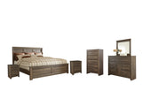 Juararo Queen Panel Bed with Mirrored Dresser, Chest and 2 Nightstands in Dark Brown from Ashley - Luna Furniture