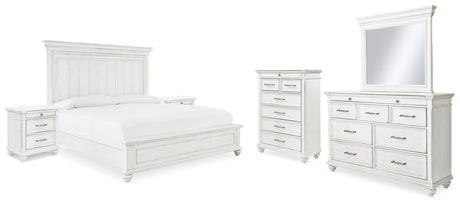 Kanwyn King Panel Bed with Mirrored Dresser, Chest and 2 Nightstands in Whitewash from Ashley - Luna Furniture