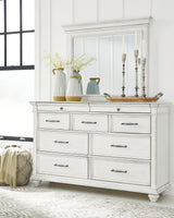 Kanwyn Queen Panel Bed with Mirrored Dresser in Whitewash from Ashley - Luna Furniture