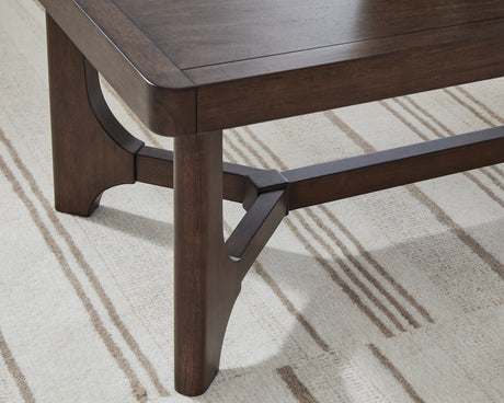 Korestone Dark Brown Coffee Table from Ashley - Luna Furniture