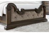 Maylee Dark Brown King Upholstered Panel Bed from Ashley - Luna Furniture