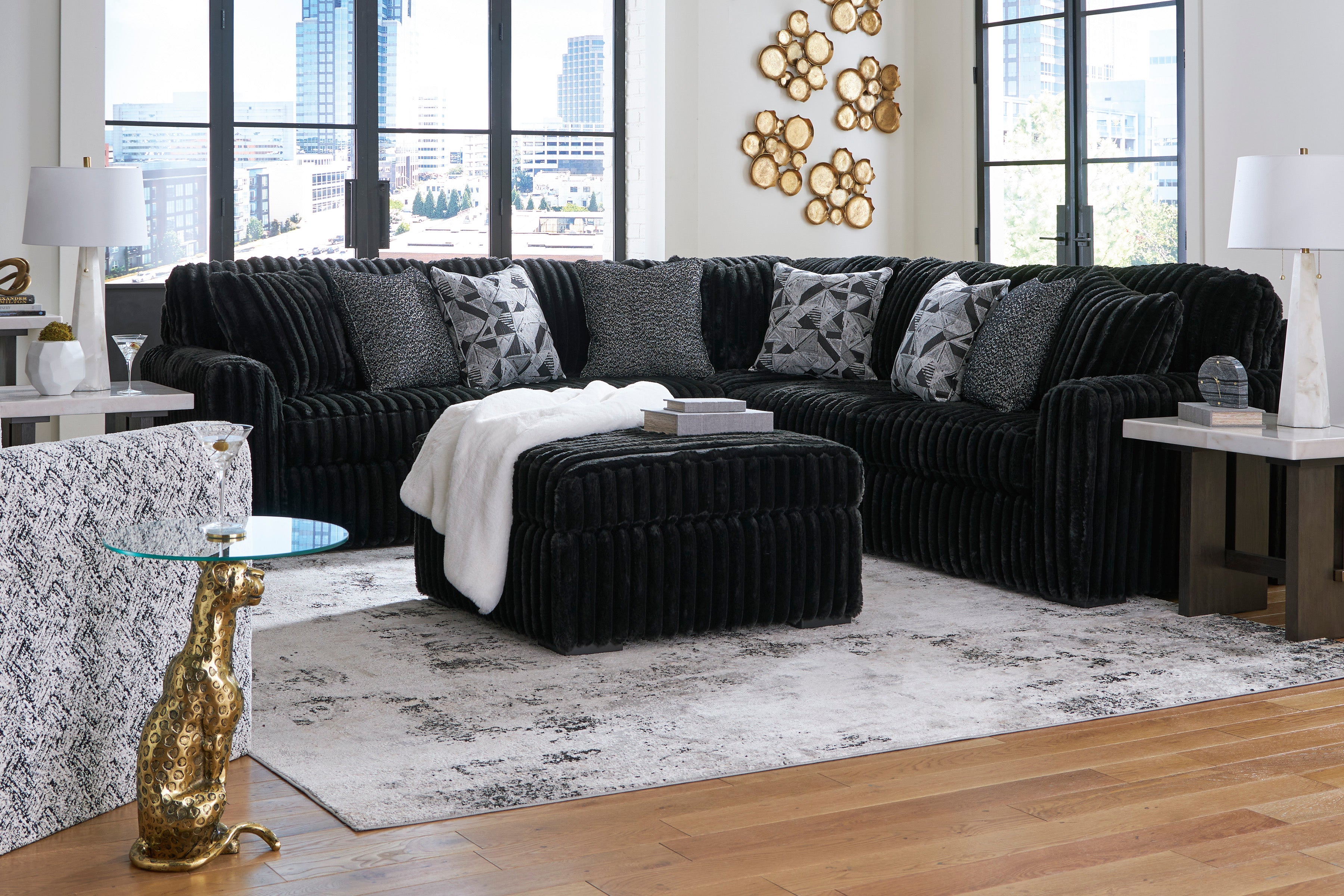 Ashley Midnight-Madness 3-Piece Sectional with Ottoman in Onyx
