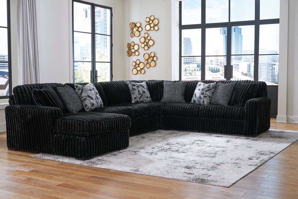 Midnight-Madness 4-Piece Sectional with Ottoman in Onyx from Ashley - Luna Furniture