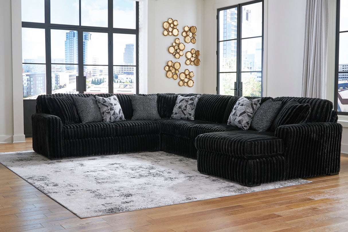 Midnight-Madness 4-Piece Sectional with Ottoman in Onyx from Ashley - Luna Furniture