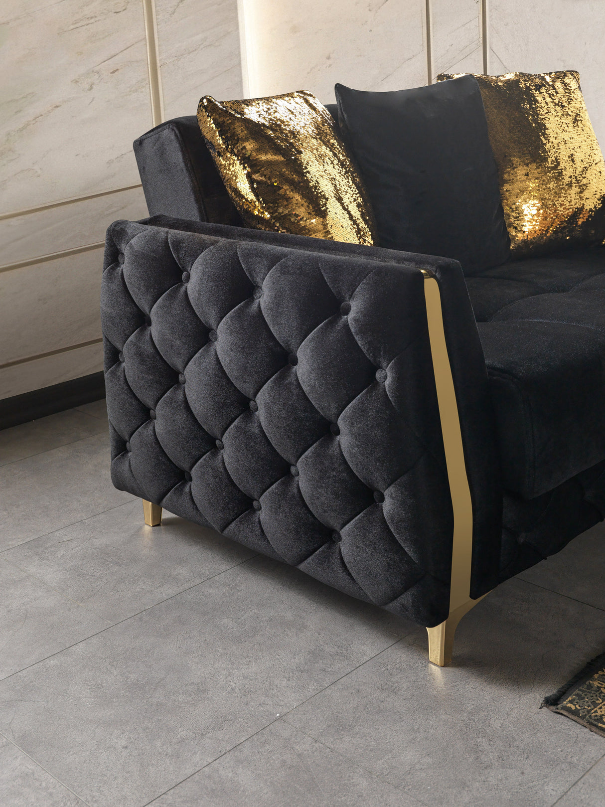 Florence Black sofa side detail, quilted black velvet with gold-trimmed arm edge