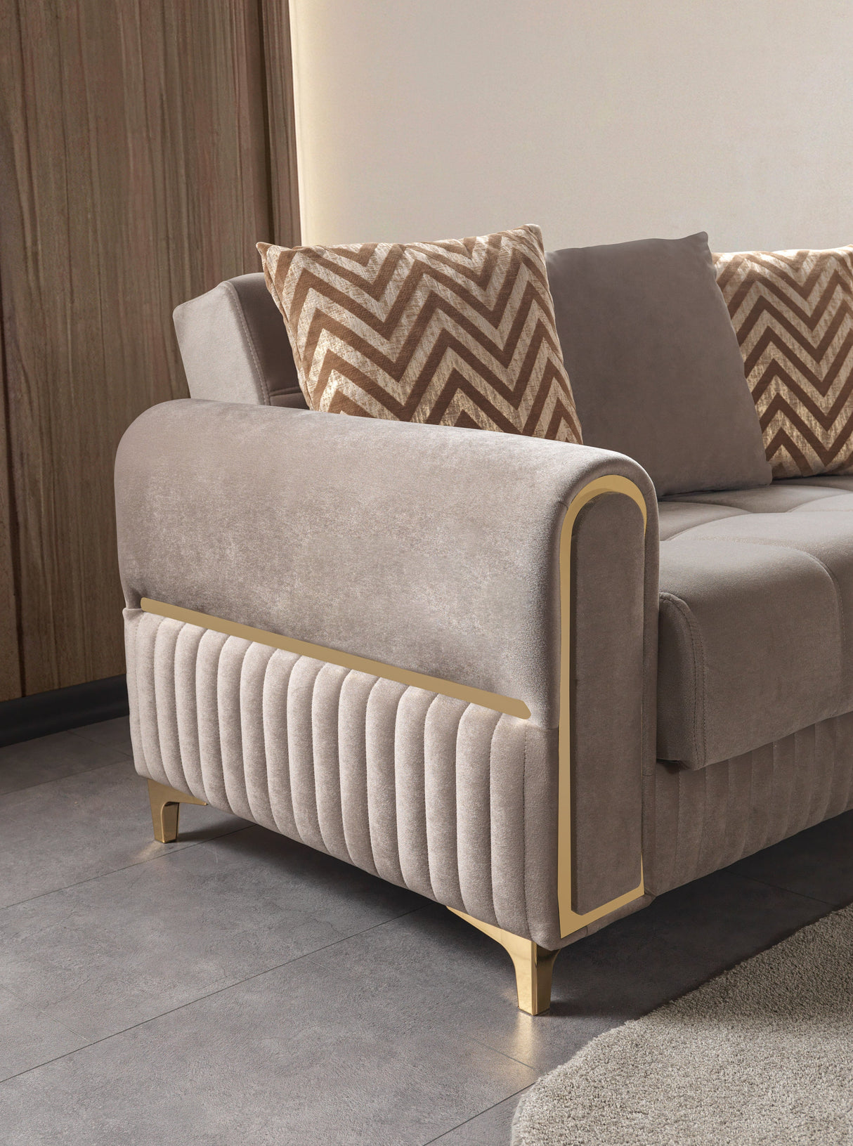 Sandra Coffee Loveseat, gold-trimmed arm and pleated base, side detail