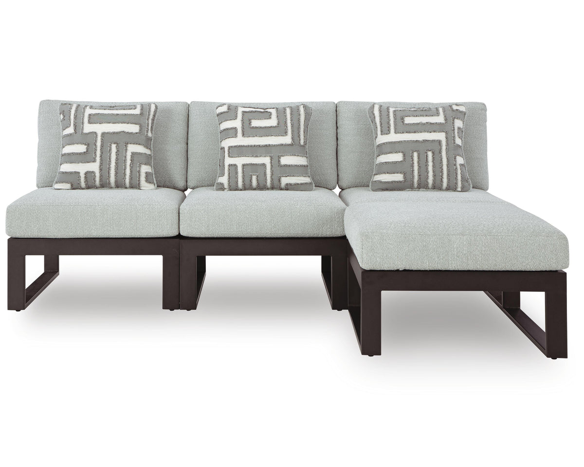 Beachloft outdoor sectional chaise, light gray cushions with geometric pillows, front view