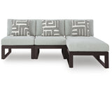 Beachloft outdoor sectional chaise, light gray cushions with geometric pillows, front view