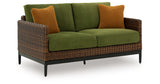 Horizon Hall Brown/Green Outdoor Loveseat with Cushion from Ashley Furniture - Luna Furniture