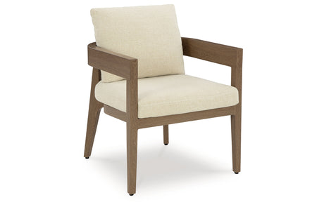 Serene Bay Dark Brown/White Outdoor Dining Arm Chair with Cushion from Ashley Furniture - Luna Furniture