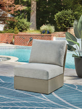 Kimpton Isle Brown/Beige Outdoor Armless Chair with Cushion from Ashley Furniture - Luna Furniture