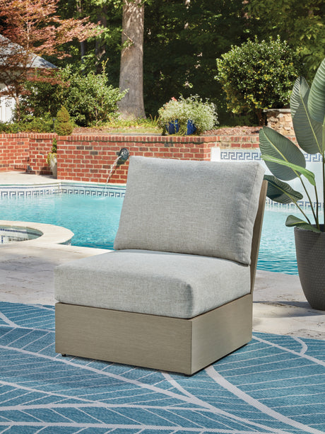 Kimpton Isle Brown/Beige Outdoor Armless Chair with Cushion from Ashley Furniture - Luna Furniture
