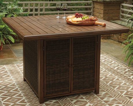 Paradise Trail Medium Brown Bar Table with Fire Pit from Ashley Furniture - Luna Furniture