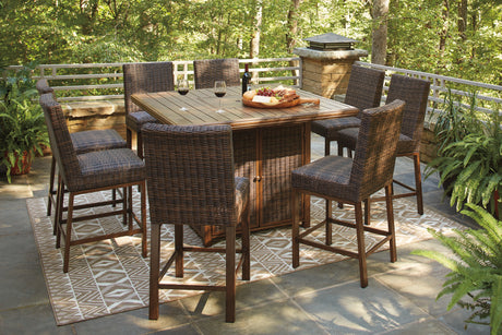 Paradise Trail Medium Brown Outdoor Counter Height Dining Table with 6 Barstools from Ashley Furniture - Luna Furniture