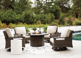 Paradise Trail Medium Brown Outdoor Fire Pit Table with 4 Lounge Chairs from Ashley Furniture - Luna Furniture