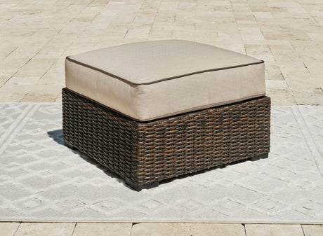Coastline Bay Brown Outdoor Ottoman with Cushion from Ashley - Luna Furniture