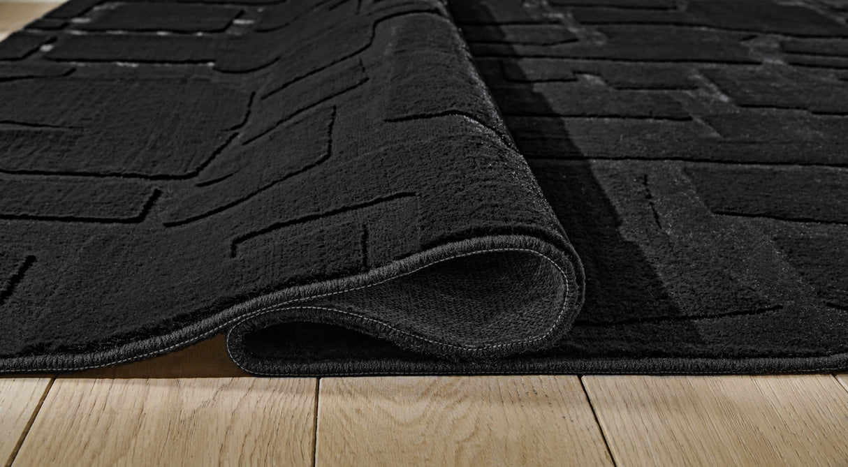 Gibbswell Black Washable Medium Rug from Ashley Furniture - Luna Furniture