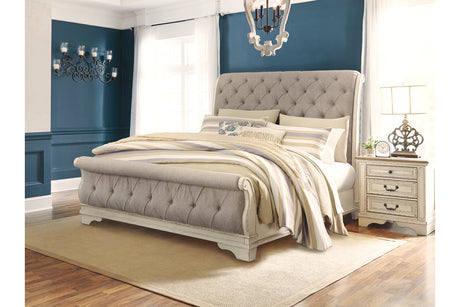 Realyn Chipped White Upholstered Sleigh Bedroom Set from Ashley - Luna Furniture